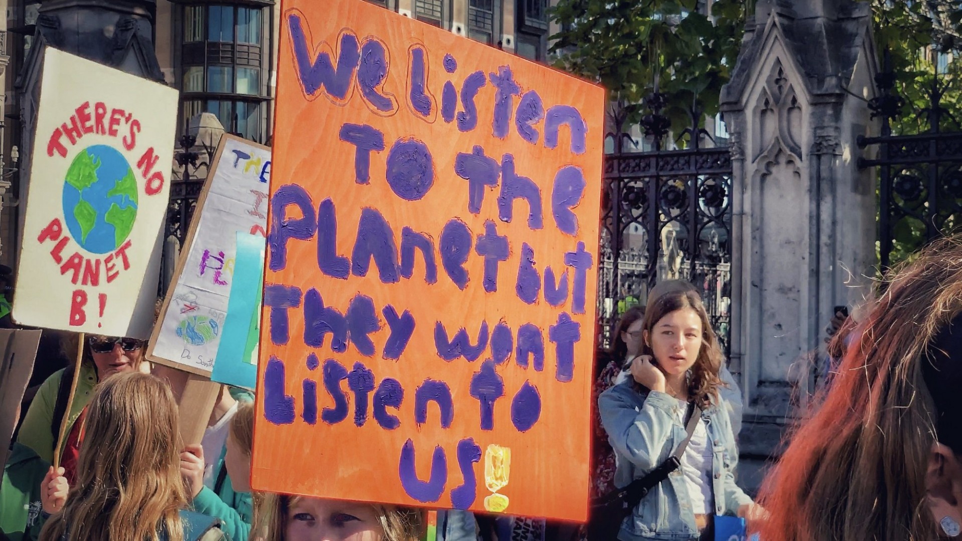 Youth climate protesters hold a sign that reads "we listen to the planet but they won't listen to us" at the Global Climate Stike  in London 